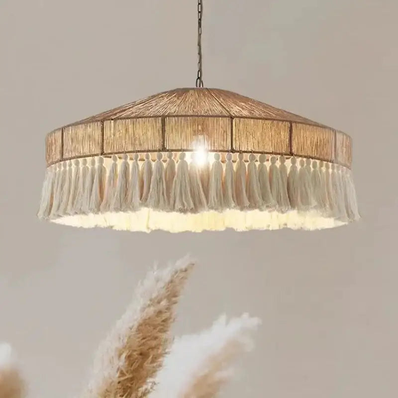 Chandelier with woven design and tassels on a neutral background Besontique Home
