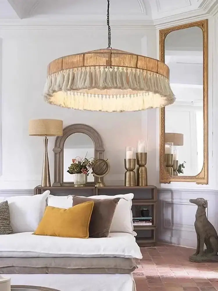 Living room with a chandelier, sofa, and decorative items Besontique Home