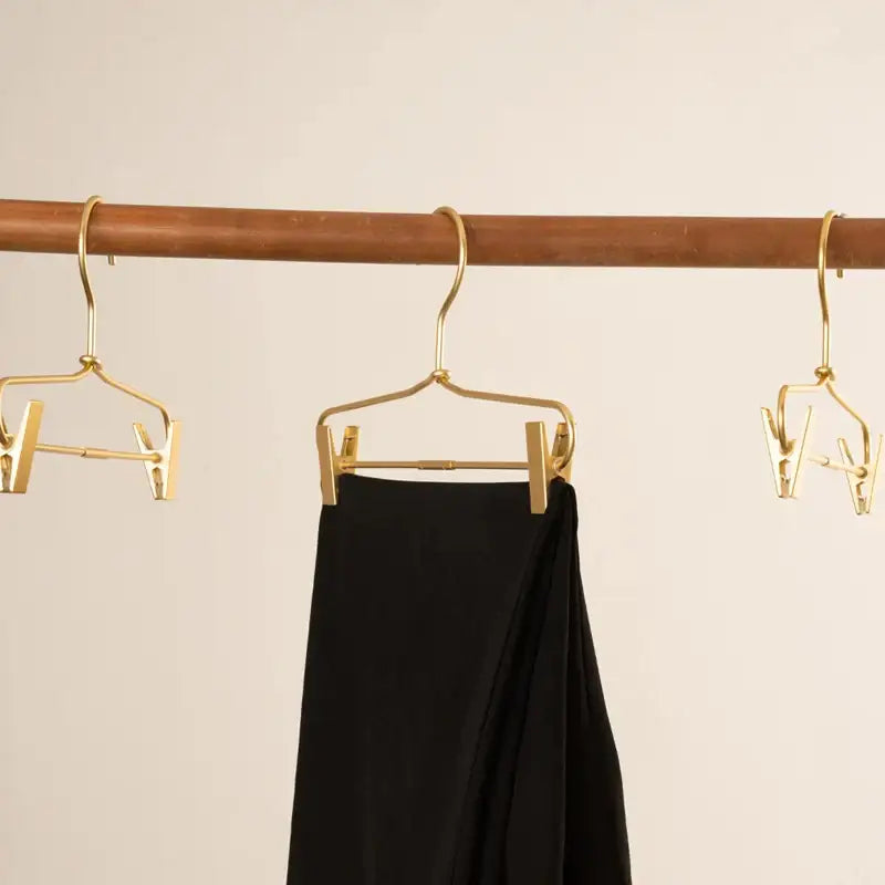 slim-gold-skirts-pants-hangers-with-clips-sleek-metal-clothes-wardrobe-trouser-rack-besontique-home-17948 - Besontique Home