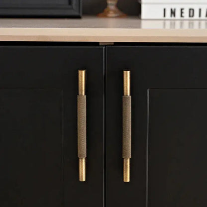 Set of bronze cabinet handles on a textured surface Besontique Home Decor 