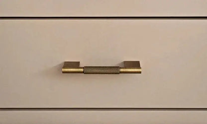 Set of bronze cabinet handles on a textured surface Besontique Home Decor 