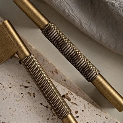 Set of bronze cabinet handles on a textured surface Besontique Home Decor 