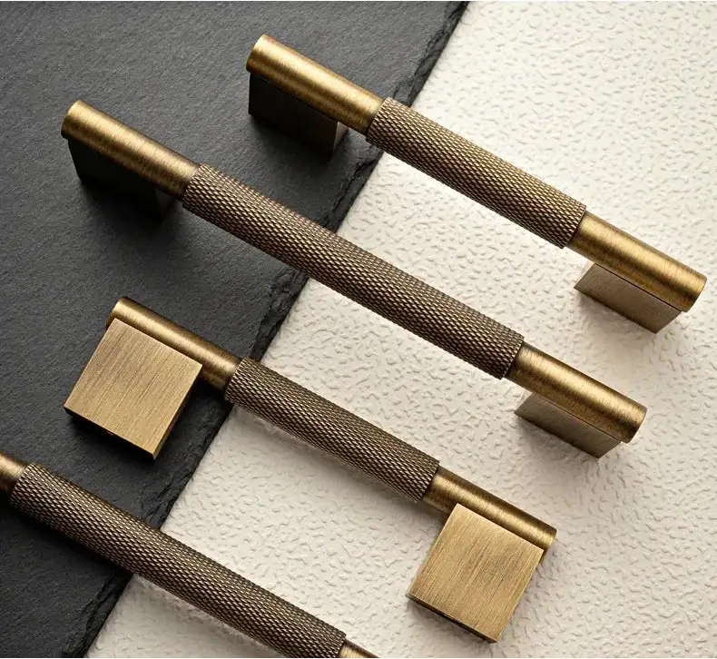 Set of bronze cabinet handles on a textured surface Besontique Home Decor 